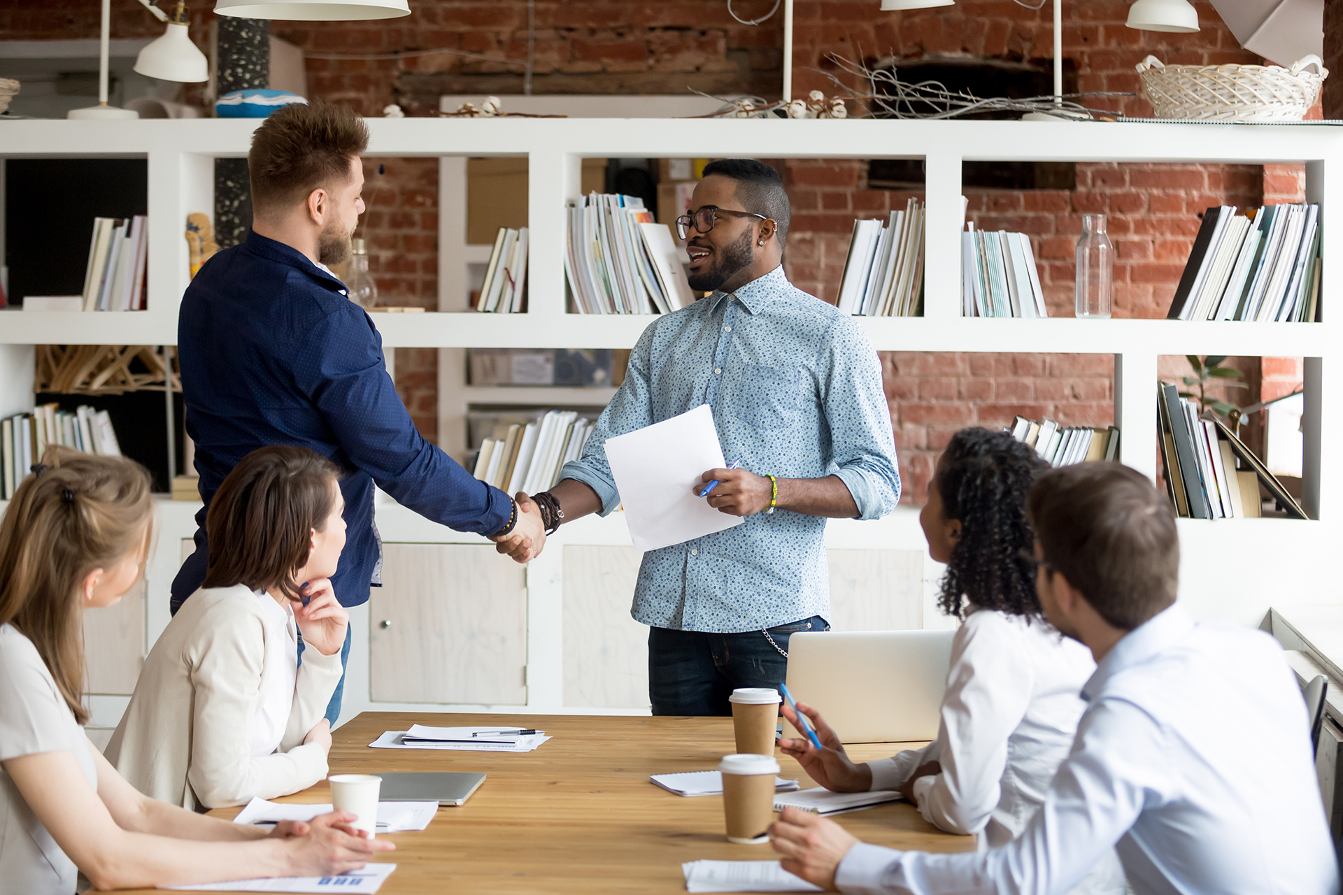 A team conducting interviews or candidate assessments in a professional setting