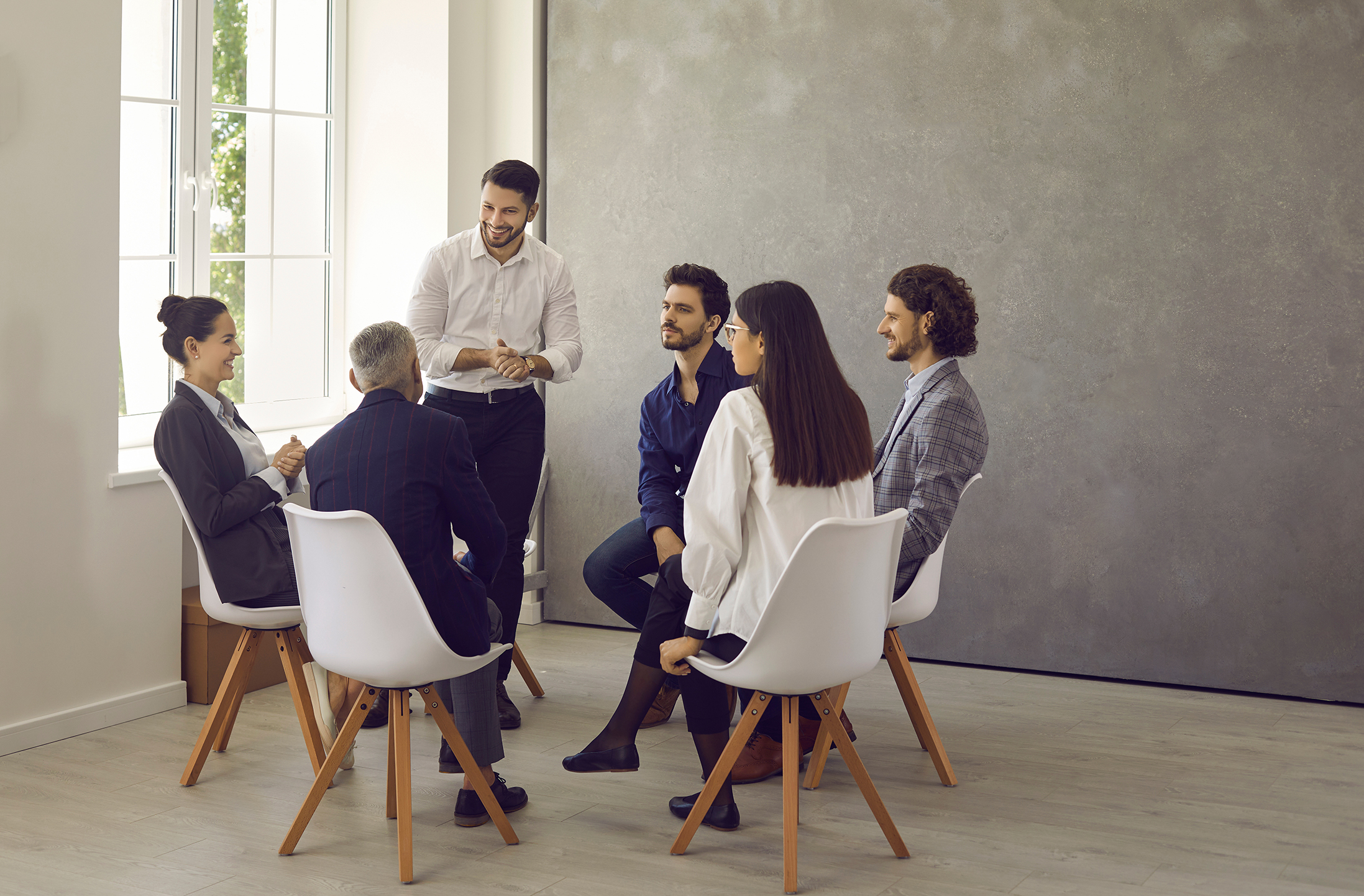 Leaders emonstrating hands-on coaching during a team meeting